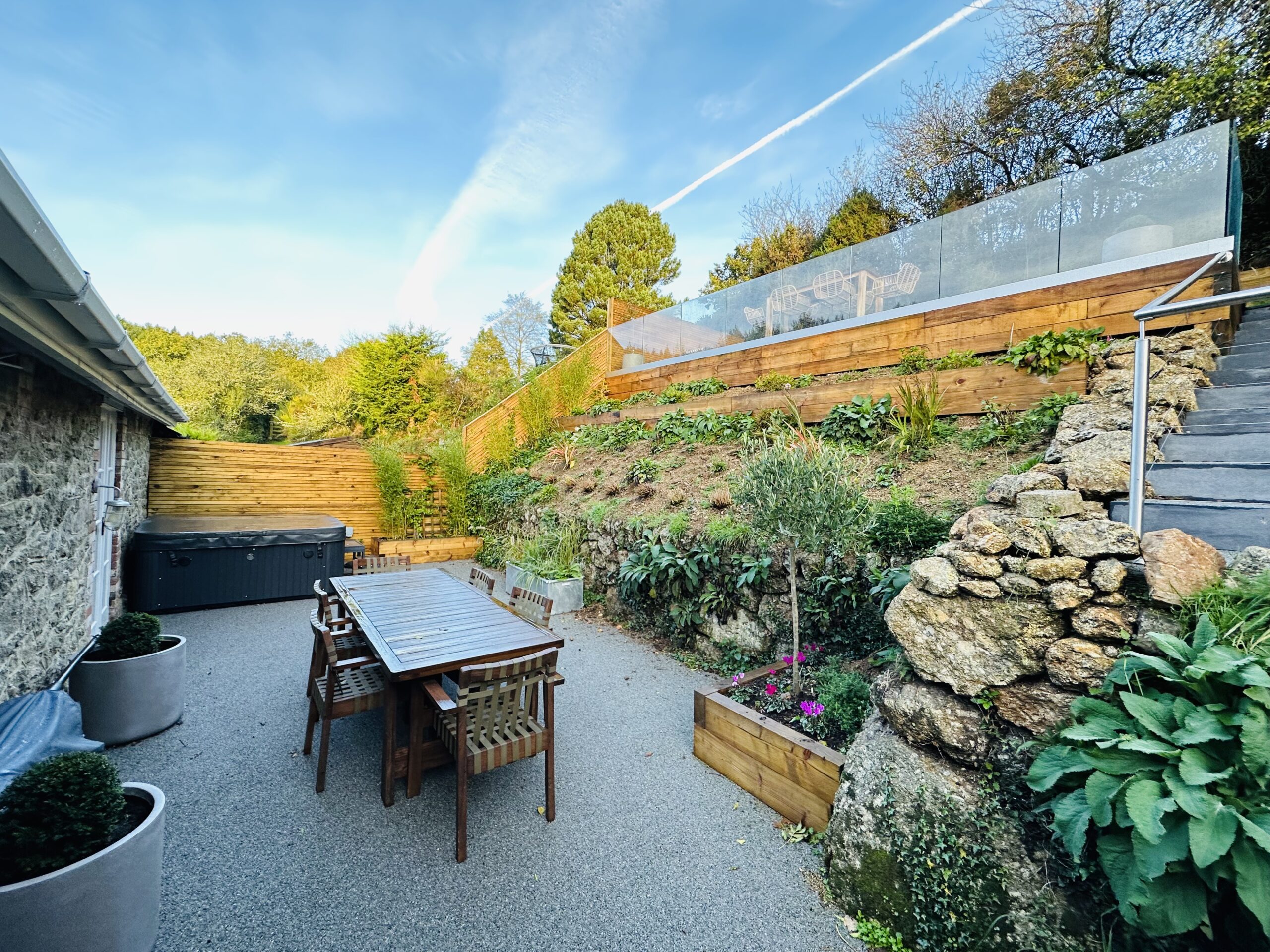 Garden steps with resin bound patio and outdoor dining furniture
