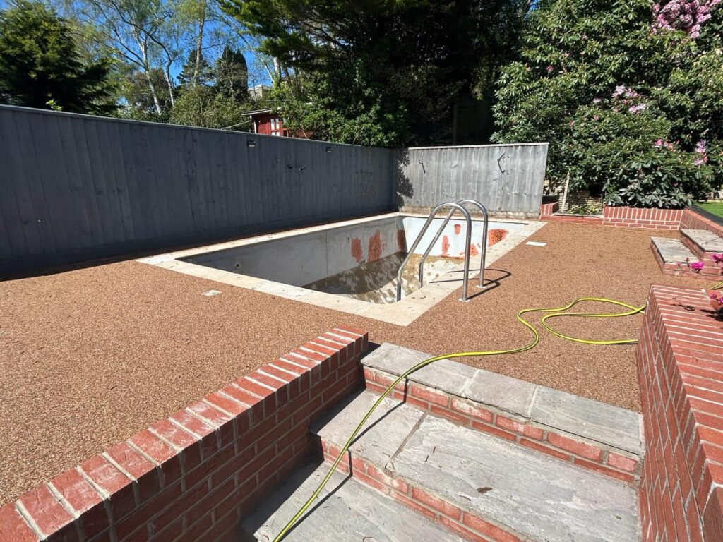Resin bound pool surfacing project in progress
