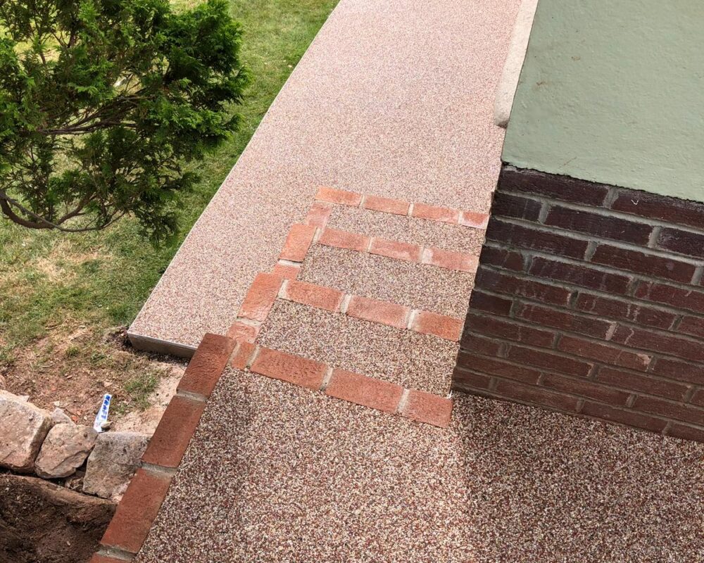 Resin bound patio and pathway with decorative brick edging