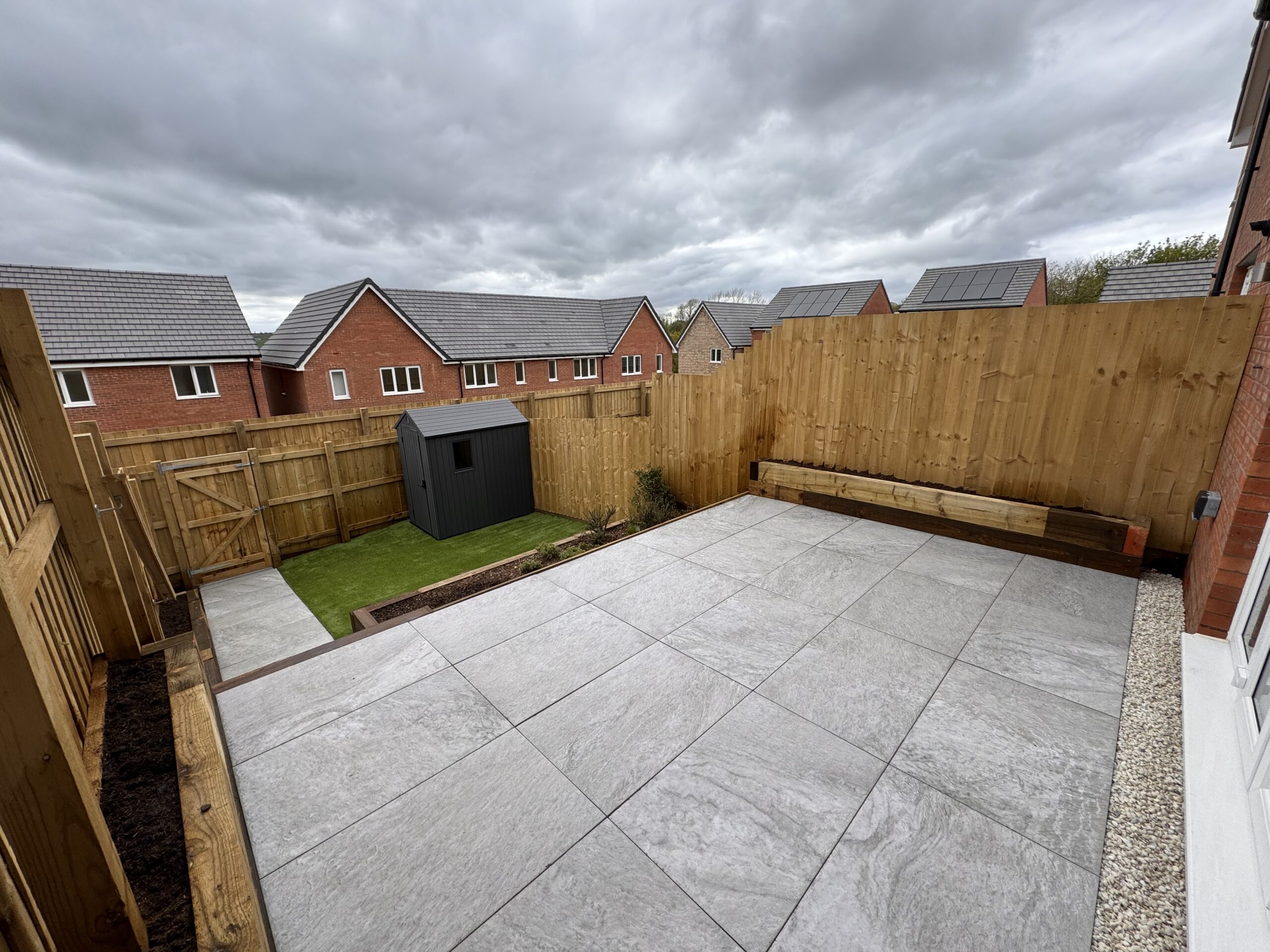 New build garden landscaping with decking and artificial grass