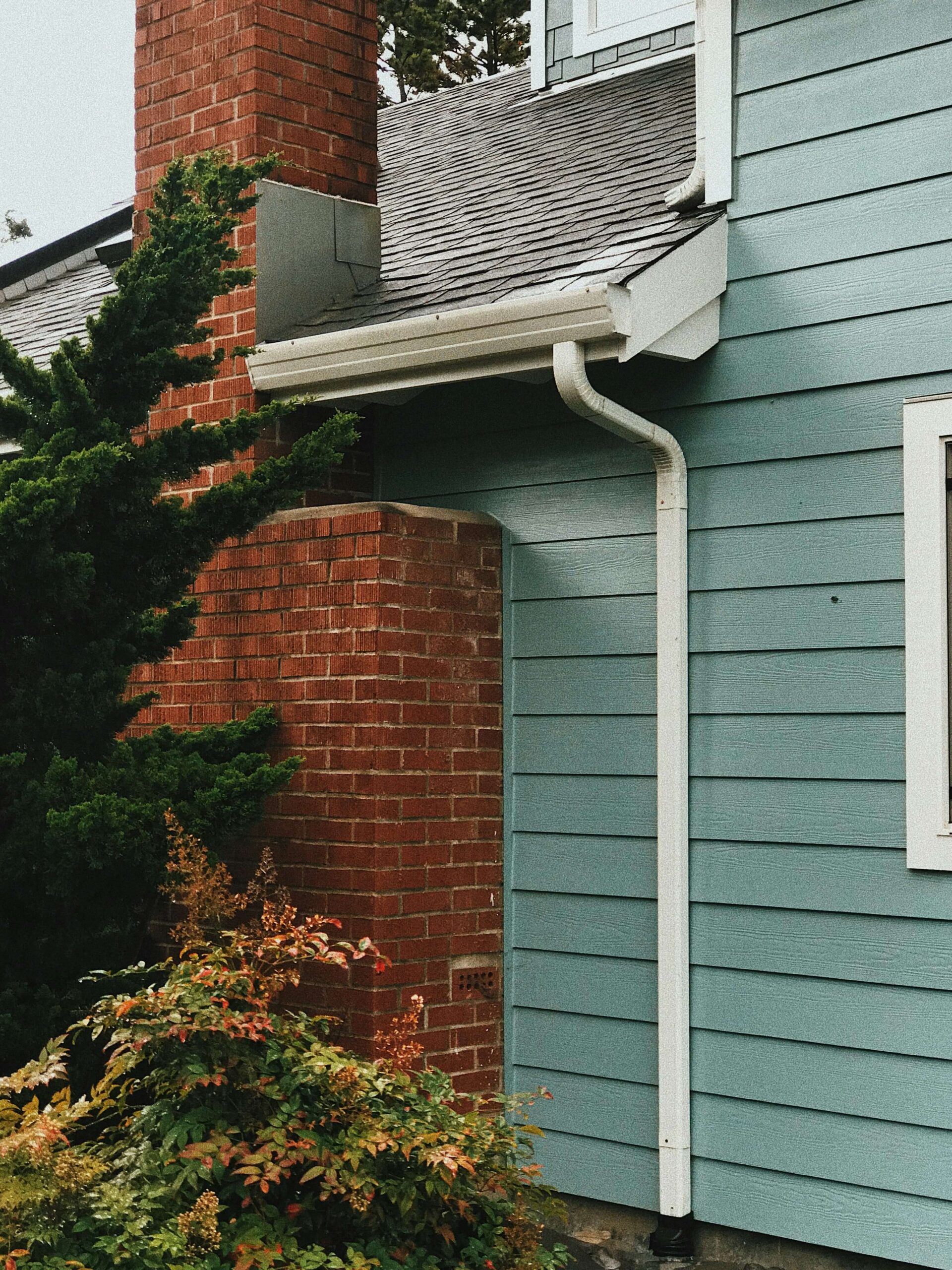 House exterior cladding, fascias and soffits installation on blue house