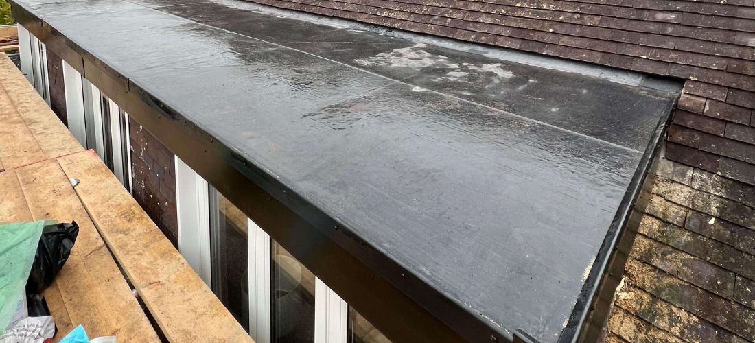 Flat roof installation and waterproofing