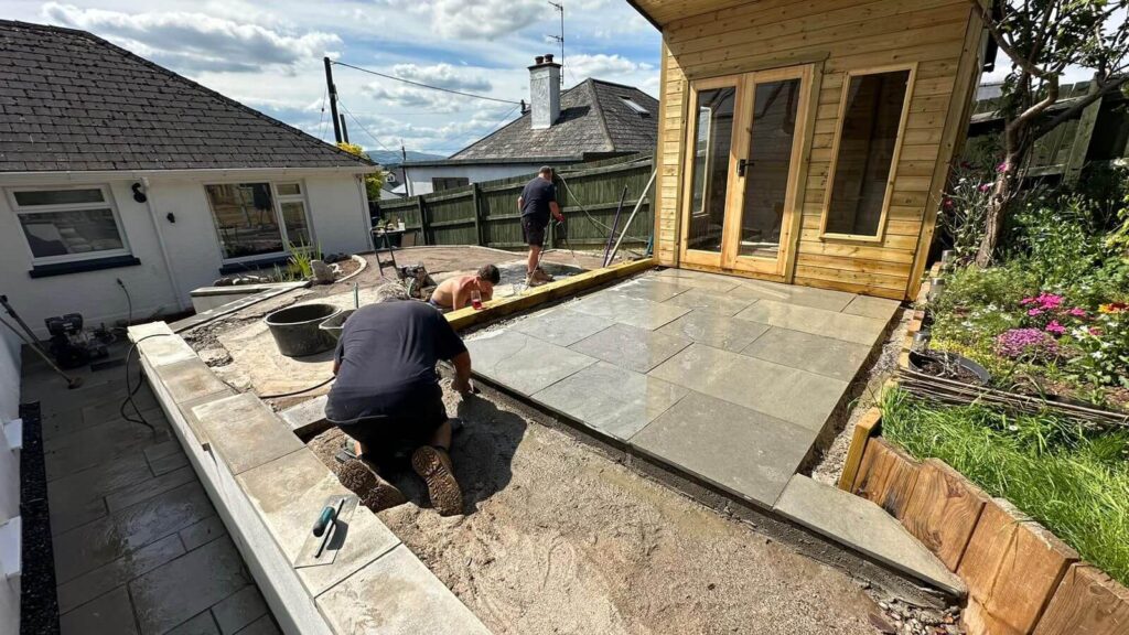 Outdoor Home Improvements team installing resin bound patio