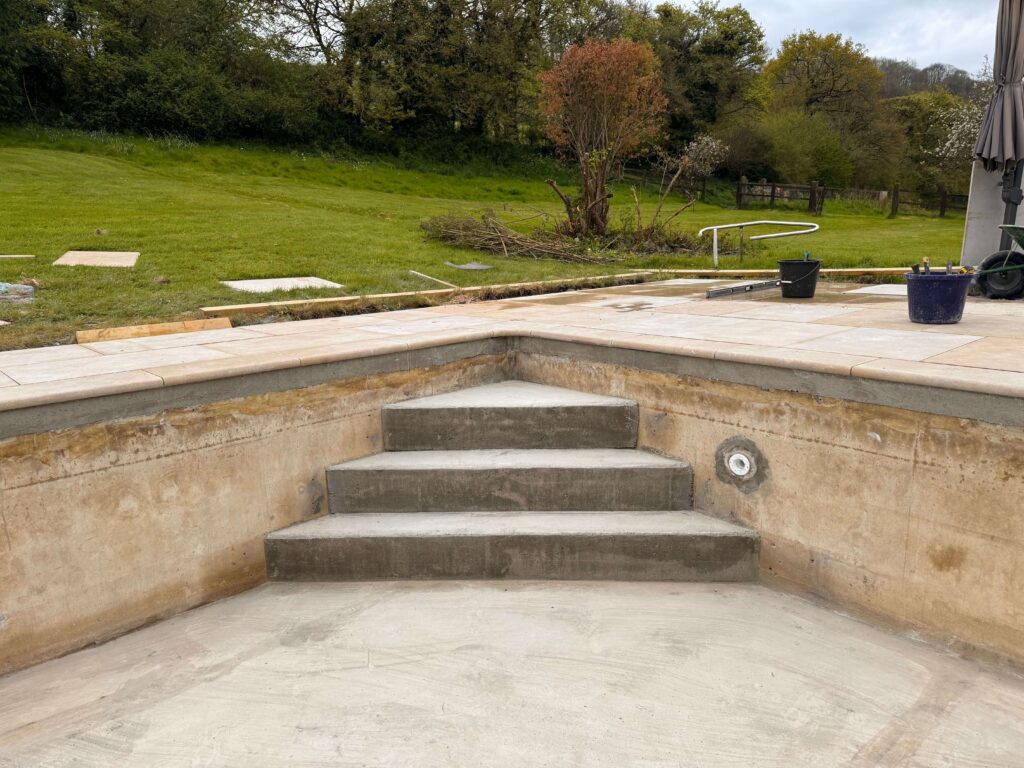 New pool surround steps installation