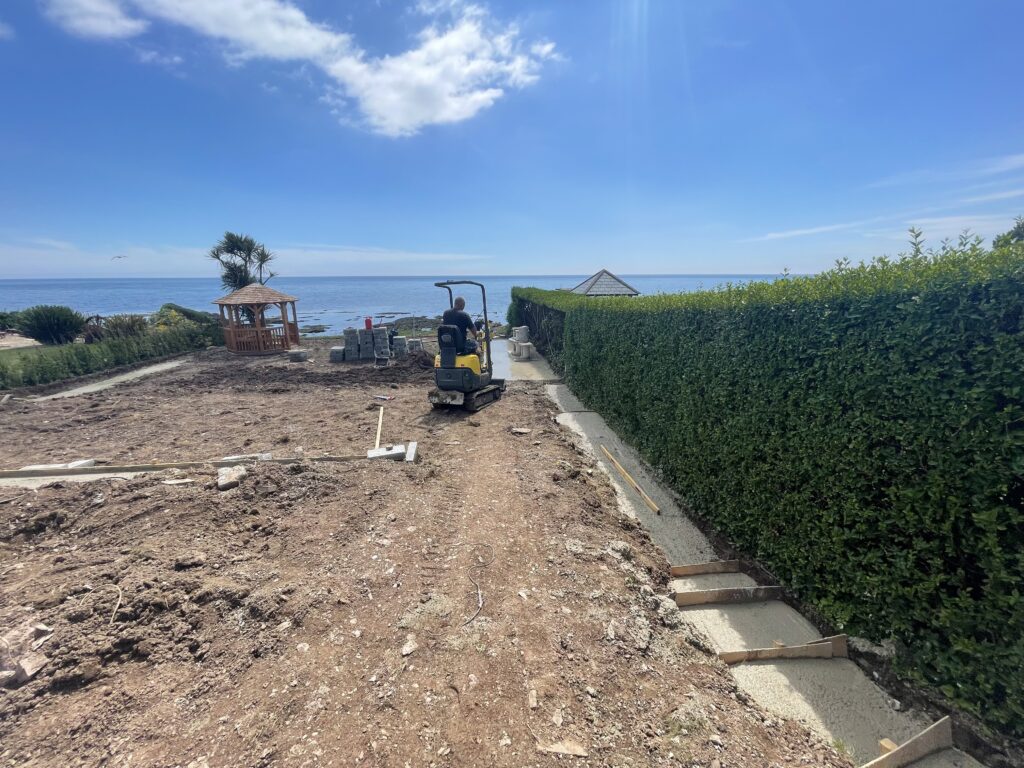 Initial groundwork excavation at coastal property garden