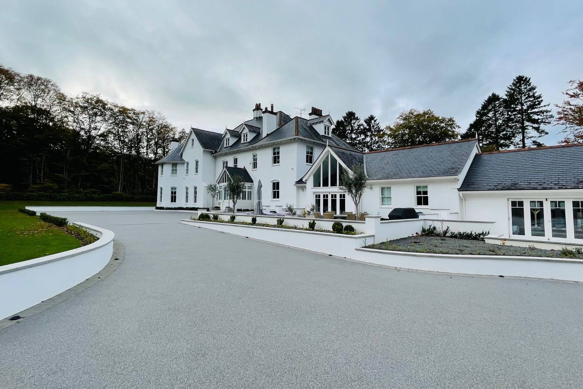 Resin bound driveway at front of large detached house