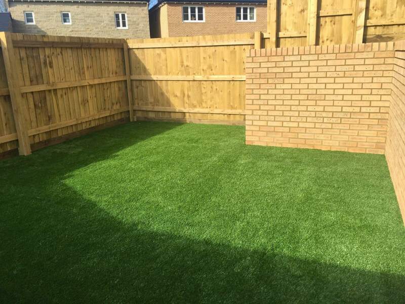 Timber fencing installation in residential garden