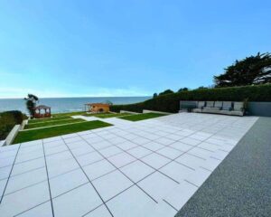 Modern resin patio and lawn with coastal sea view