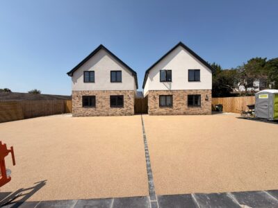 Golden resin bound driveway serving two new build houses with granite sett divider, Bristol
