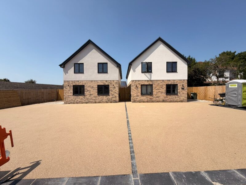 Golden resin bound driveway serving two new build houses with granite sett divider, Bristol