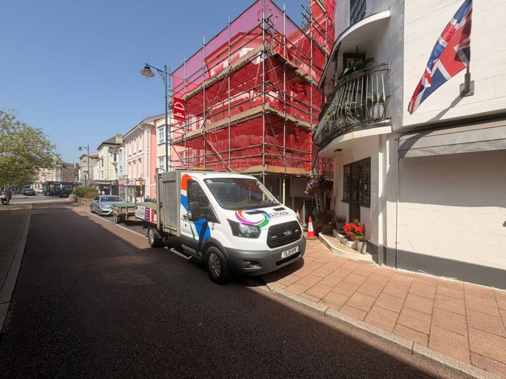 Outdoor Home Improvements van outside a Teignmouth town centre property during installation