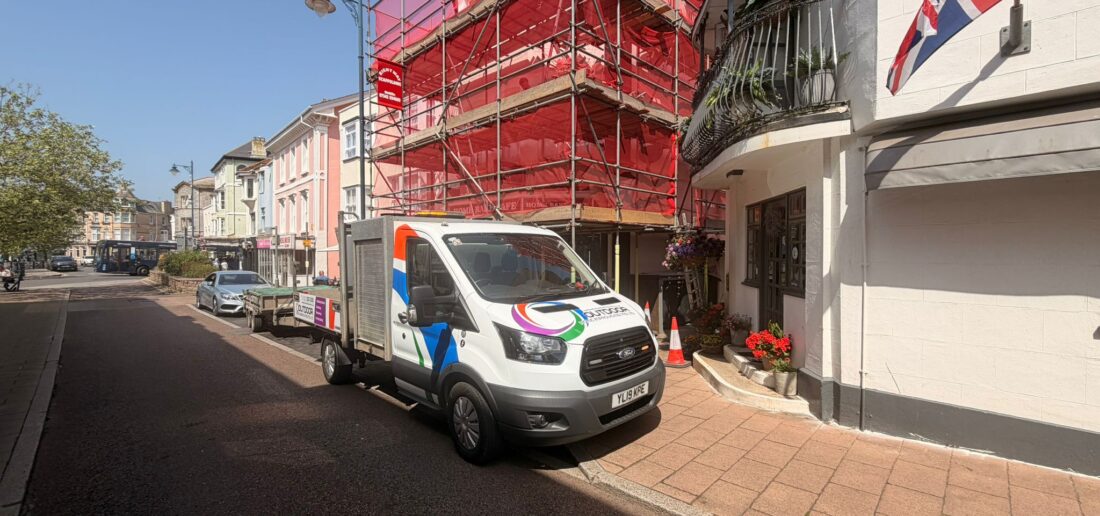 Outdoor Home Improvements van outside a Teignmouth town centre property during installation
